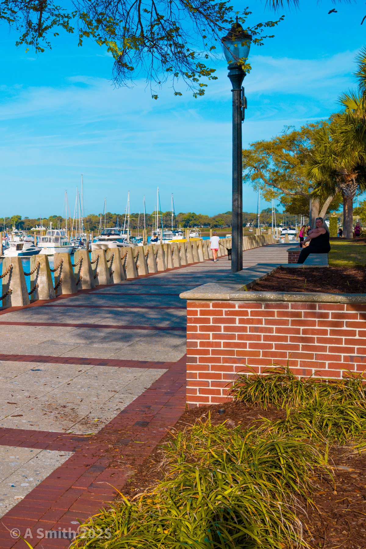 The marina side. Lamppost and brickwork where the promenade passes the marina.