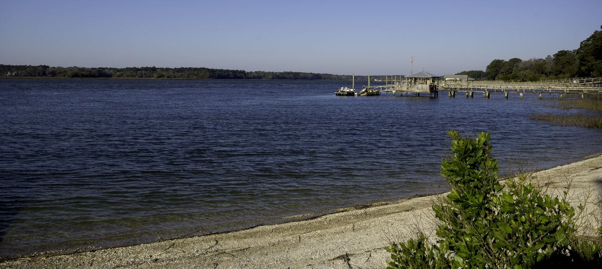 The May River at the Bluffton Oyster Factory, with the public pier stretching out over the water