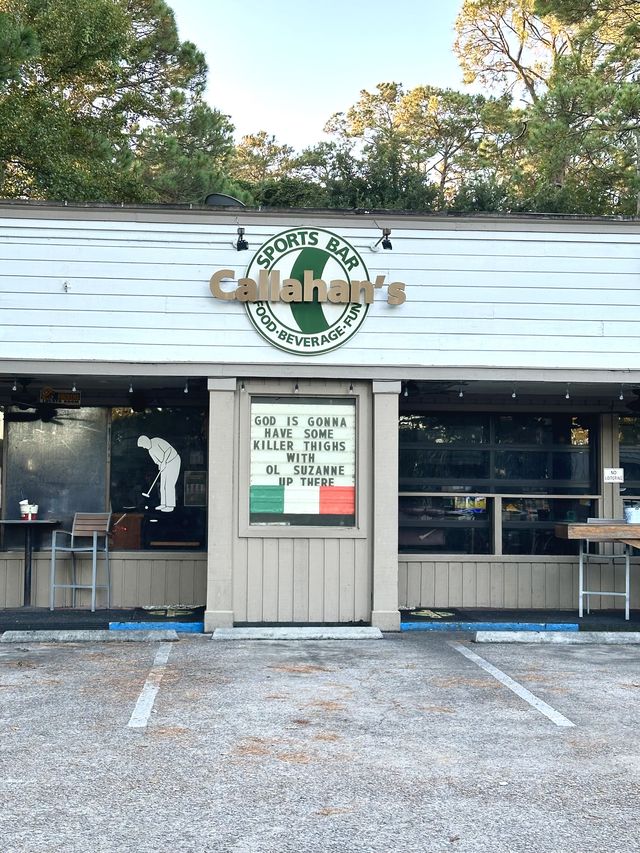 Front exterior and parking lot of Callahan's Sports Bar on Hilton Head Island