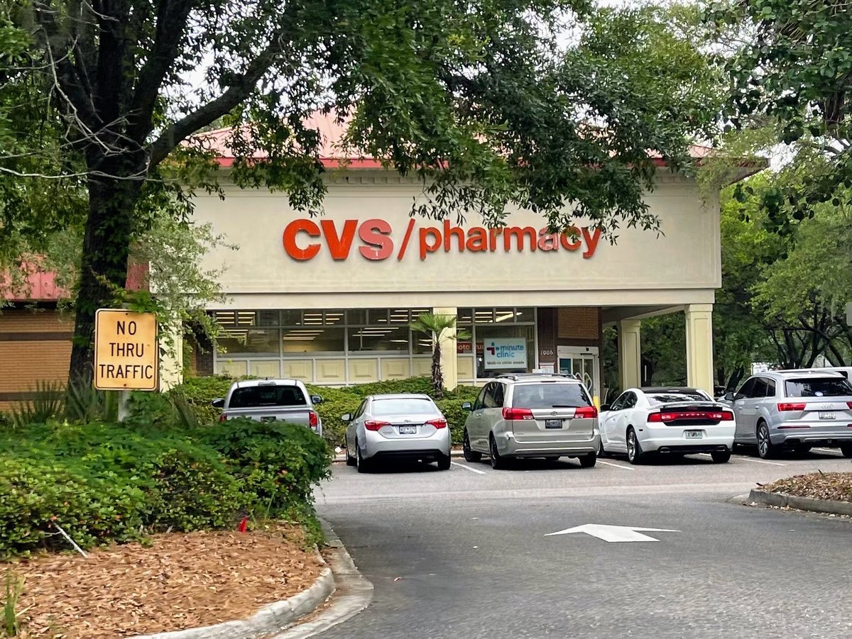 The CVS Pharmacy in Bluffton — red letters over the storefront at the Fording Island Road center, oaks over the parking lane