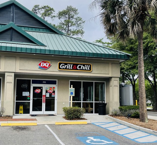 Dairy Queen Grill & Chill storefront with DQ logo and green metal roof, Bluffton SC