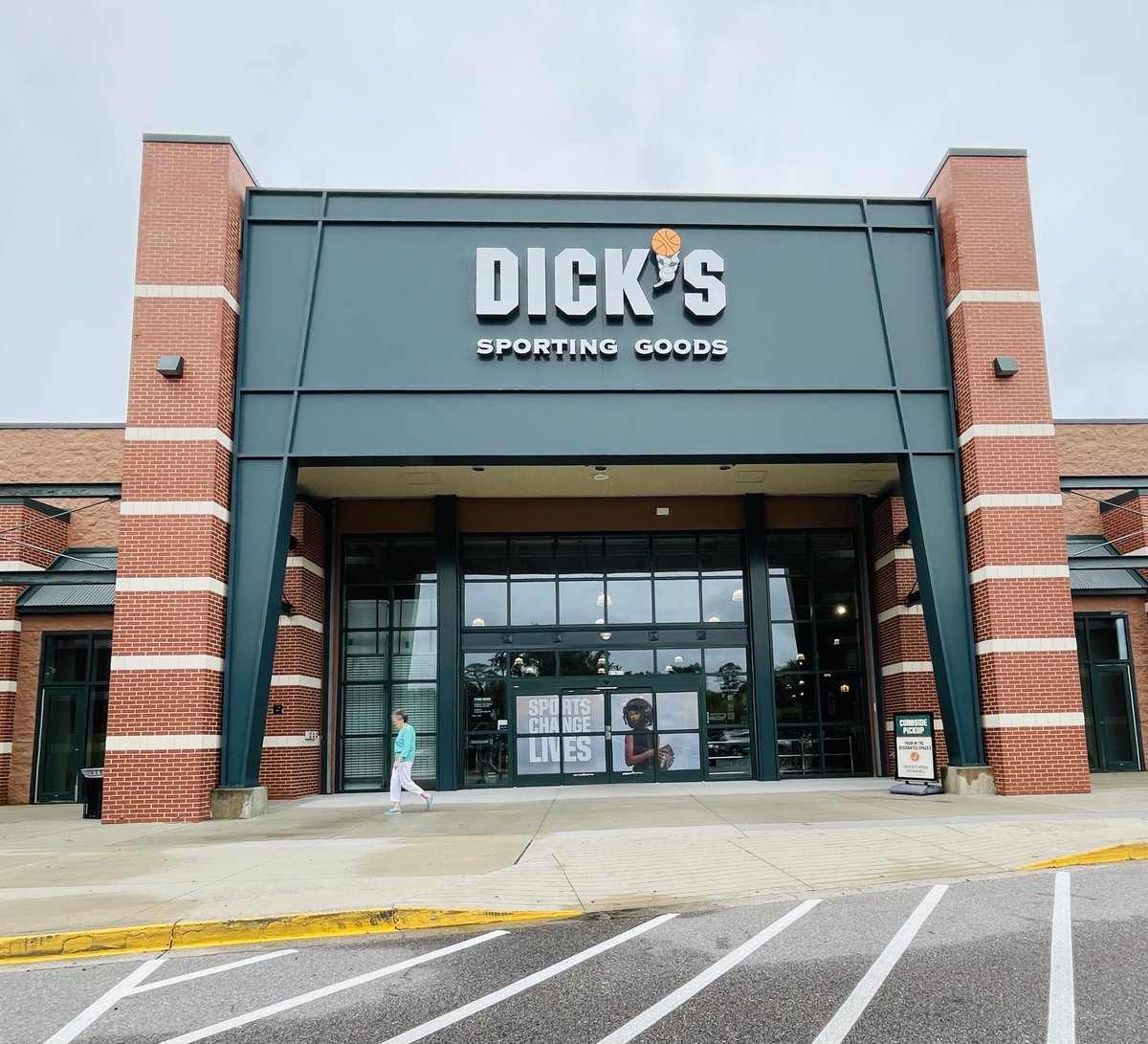 Dick's Sporting Goods storefront in Bluffton — the deep green entrance portal between brick towers