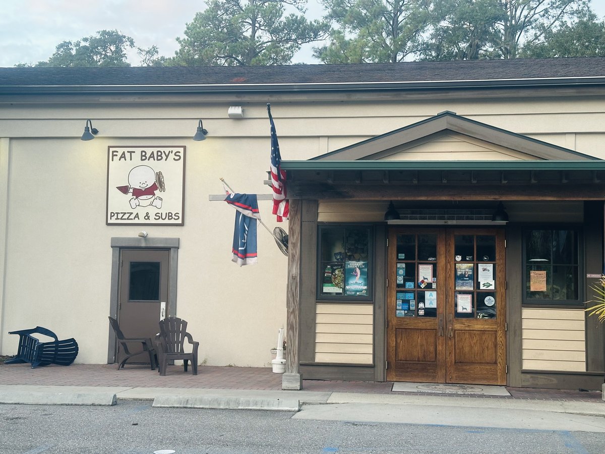 Fat Baby’s Pizza & Subs on Hilton Head Island — the baby-mascot sign and wooden double doors
