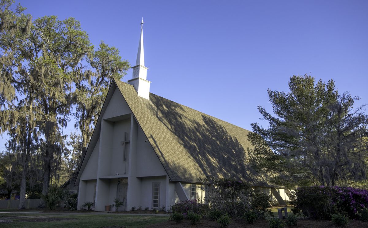 First Baptist Church in Bluffton, an A-frame church with a tall white steeple under moss-draped live oaks