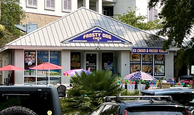 Frosty Dog Cafe at Coligny — the purple gable sign, ICE CREAM & FROZEN YOGURT banner and beach umbrellas out front