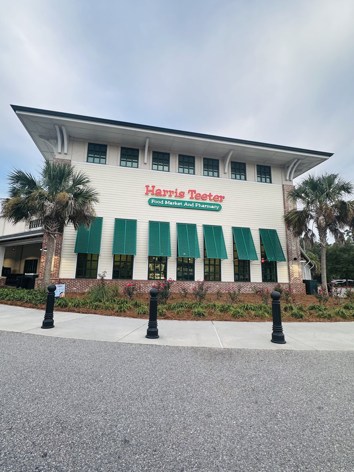 Harris Teeter on Hilton Head Island — the tall white store with green shutters and awnings, palmettos out front
