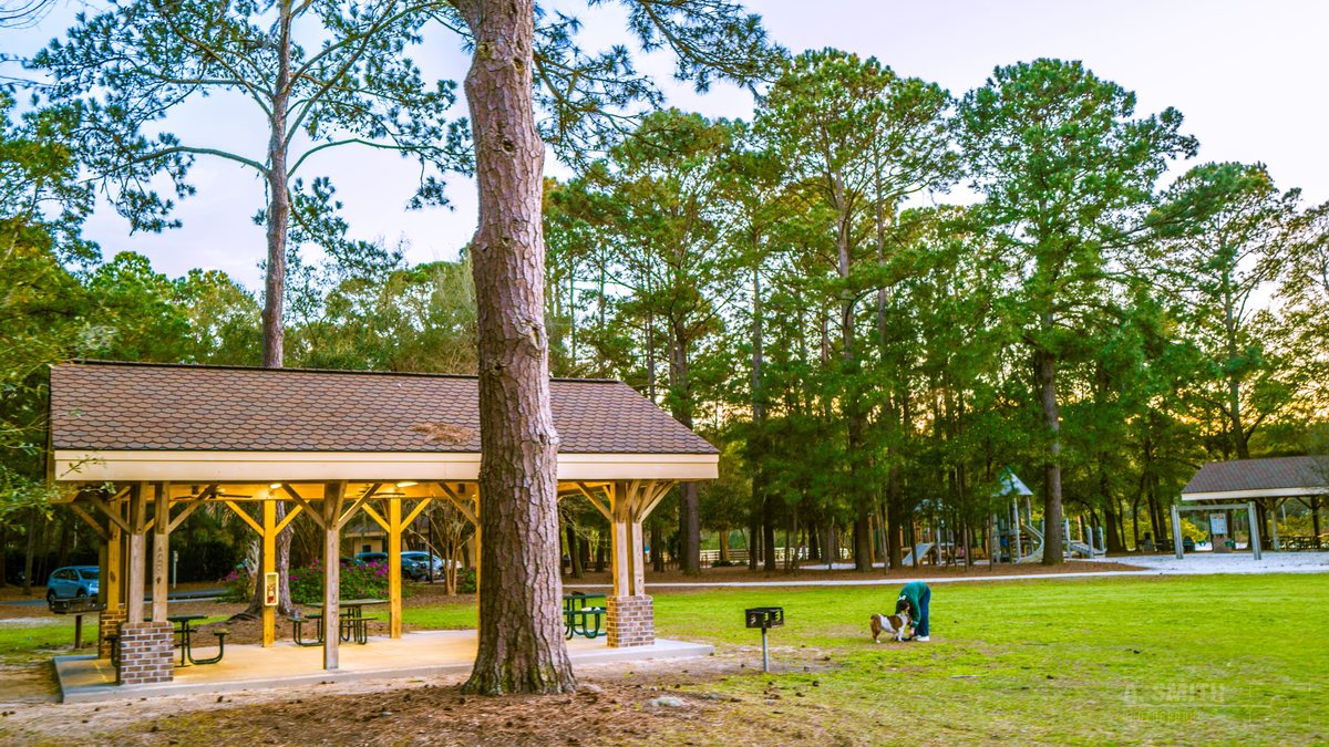 The picnic shelter. The big timber picnic shelter on the lawn, a second shelter behind it.