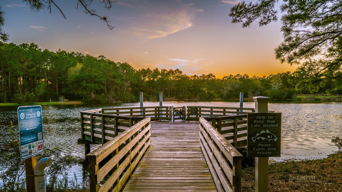 The pier at sunset. Evening on the fishing pier — catch and release, per the sign.