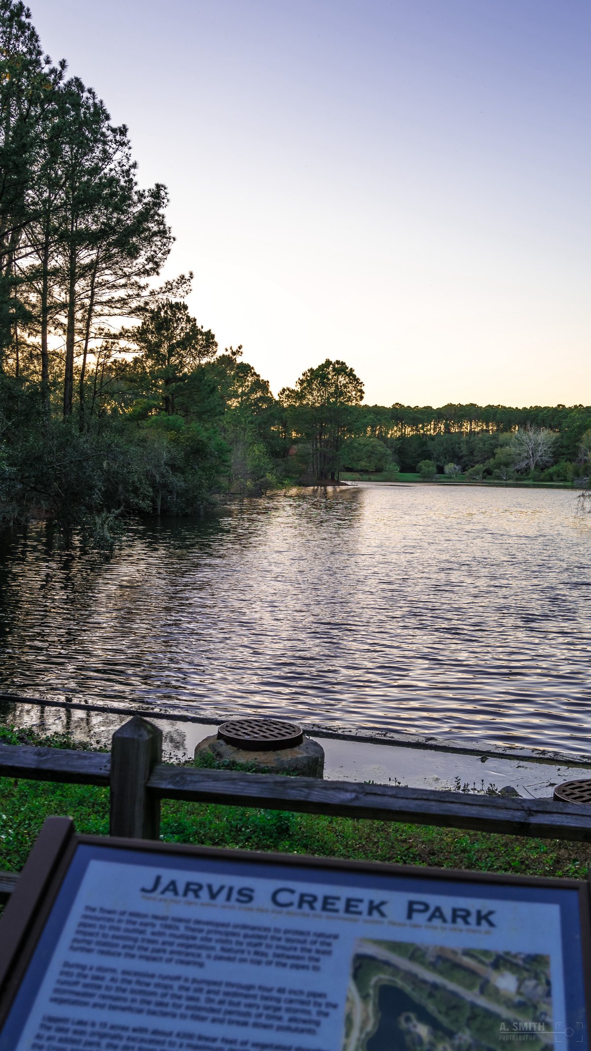 Jarvis Creek Park. The park's interpretive sign above the lake at dusk.