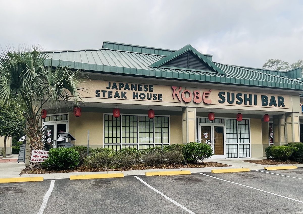 Kobe Japanese Steak House and Sushi Bar in Bluffton — red lanterns, green metal roof and a palmetto by the door
