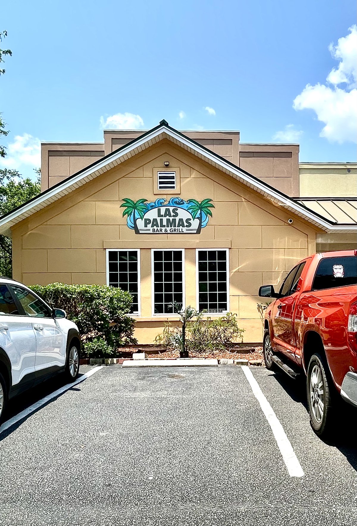 Las Palmas Bar & Grill in Okatie — the palm-tree sign on the gable end, parking right at the door