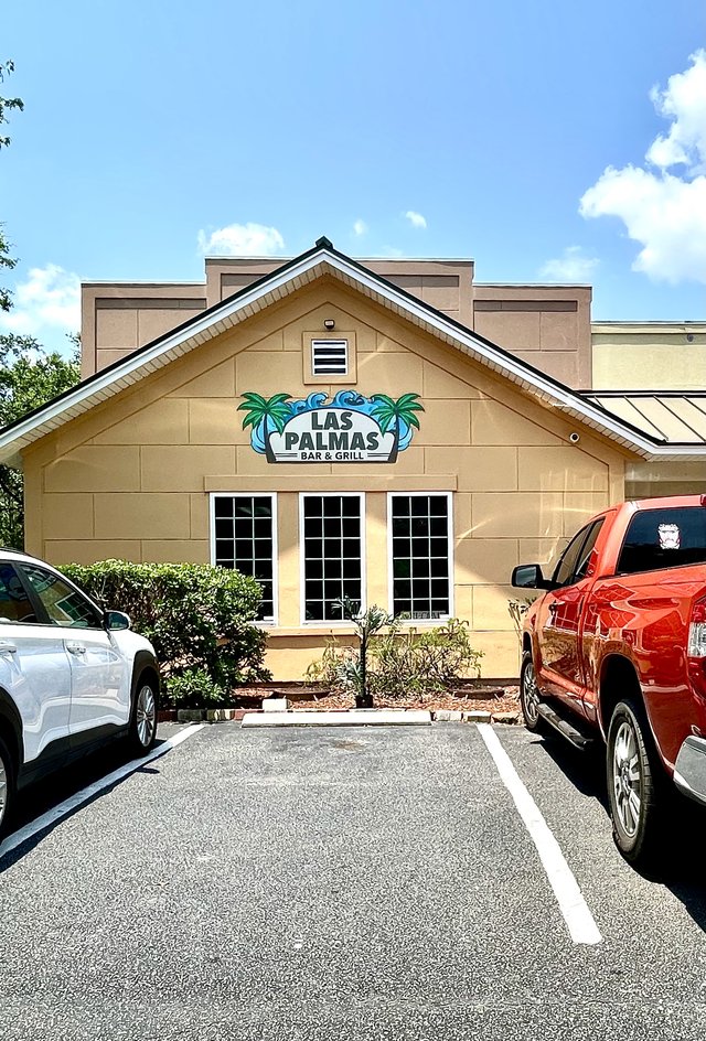 Las Palmas Bar & Grill in Okatie — the palm-tree sign on the gable end, parking right at the door
