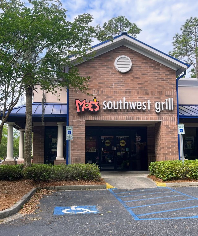 Moe's Southwest Grill brick gable storefront with red logo, Bluffton SC