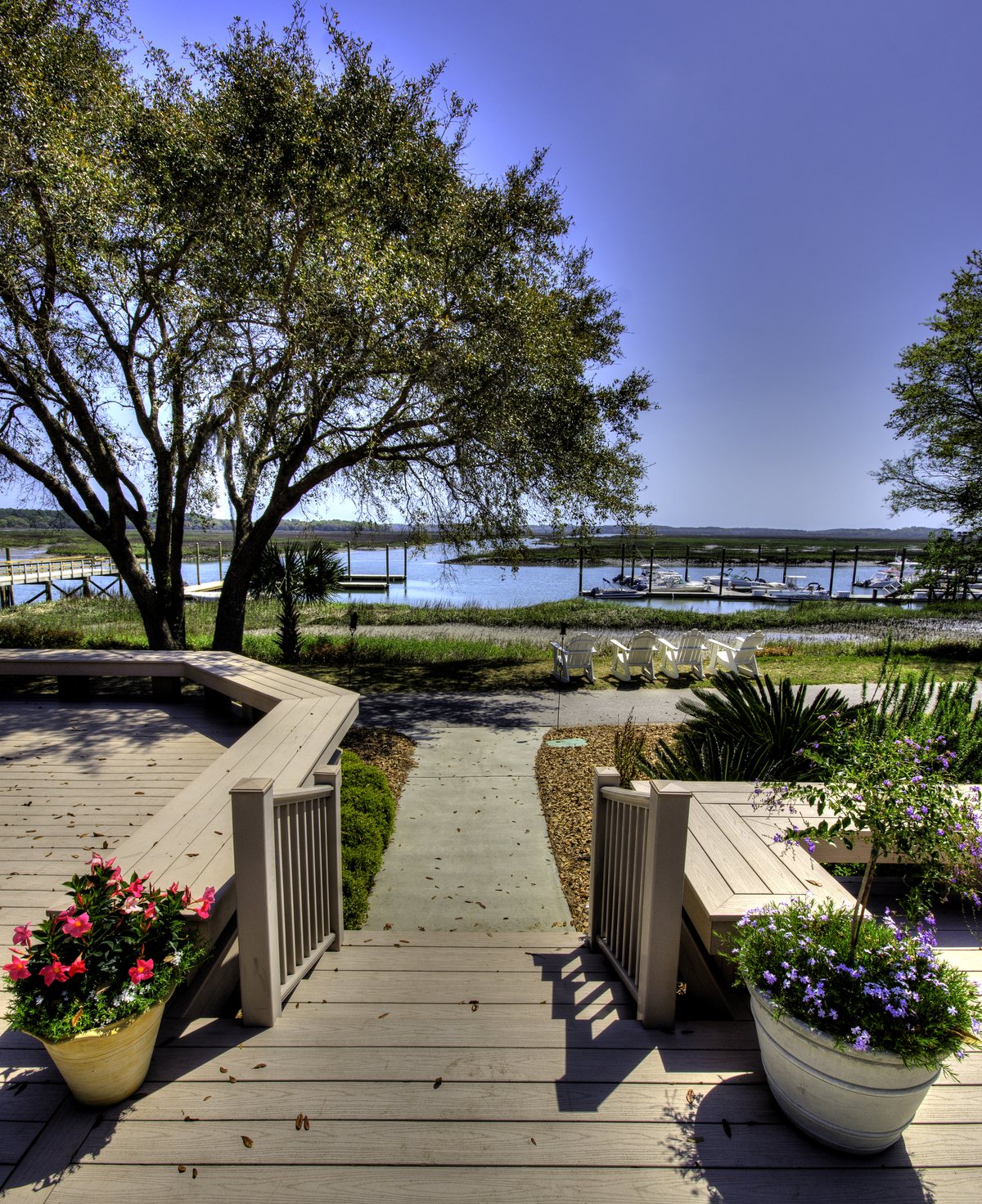Bostwick Pavilion. The pavilion deck — flower pots, benches, and the marina below.