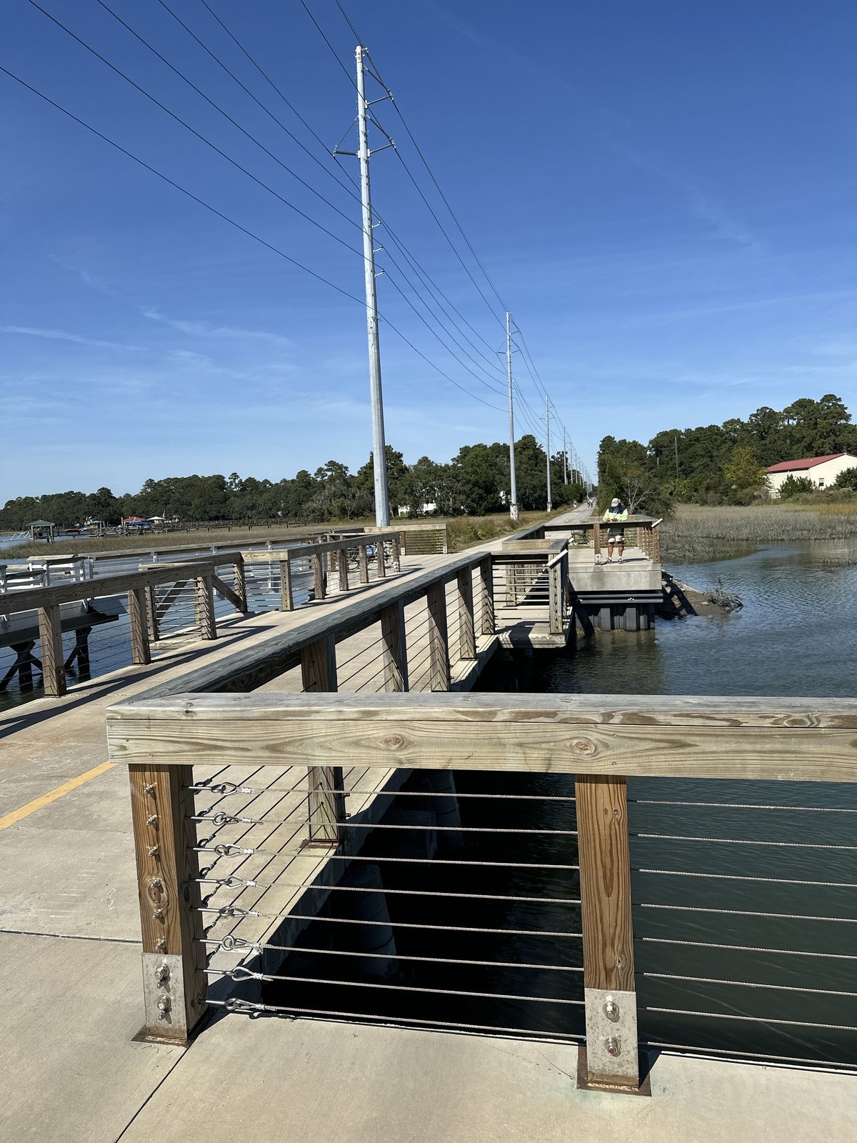 The far dock. Across the water to a dock and a houseboat, from the pier.