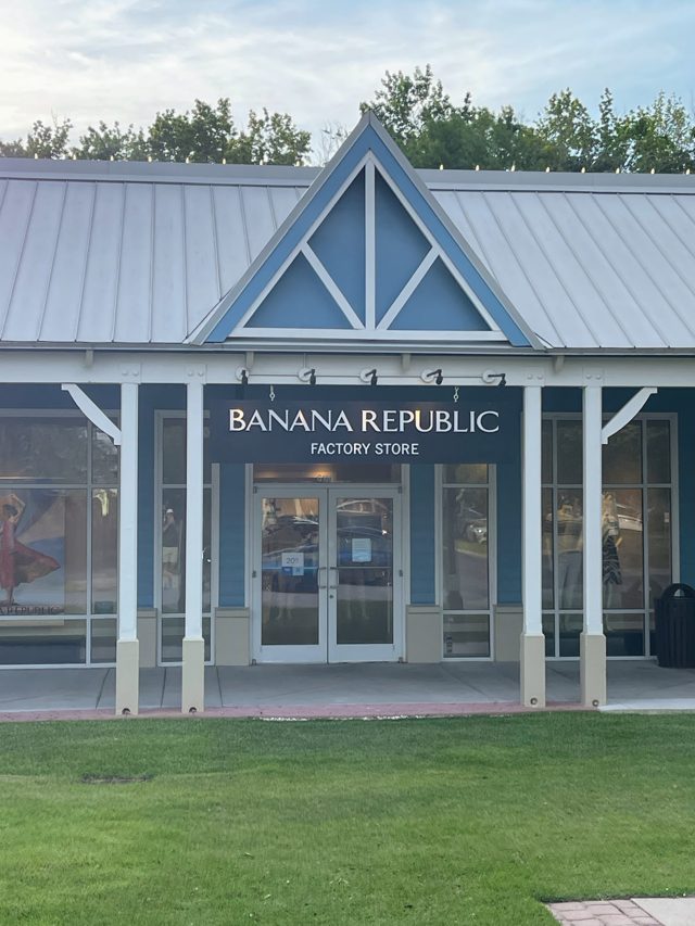 Banana Republic Factory Store at Tanger Outlets 2 — blue gable with white trusswork over the door