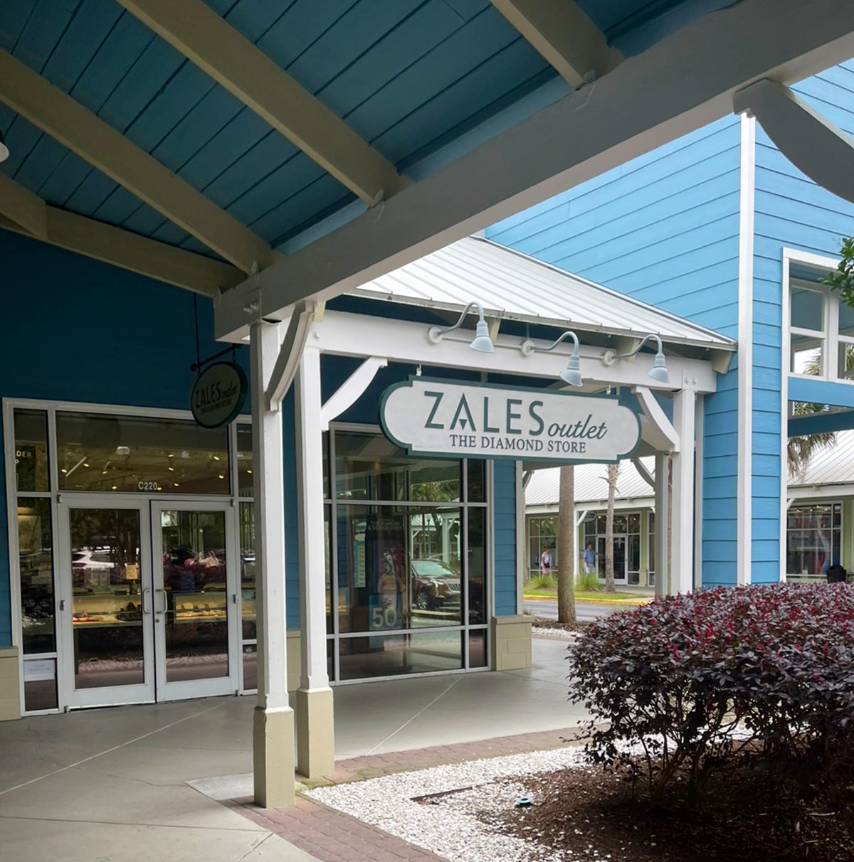 Zales Outlet at Tanger Outlets 2 — “The Diamond Store” sign under the covered walkway