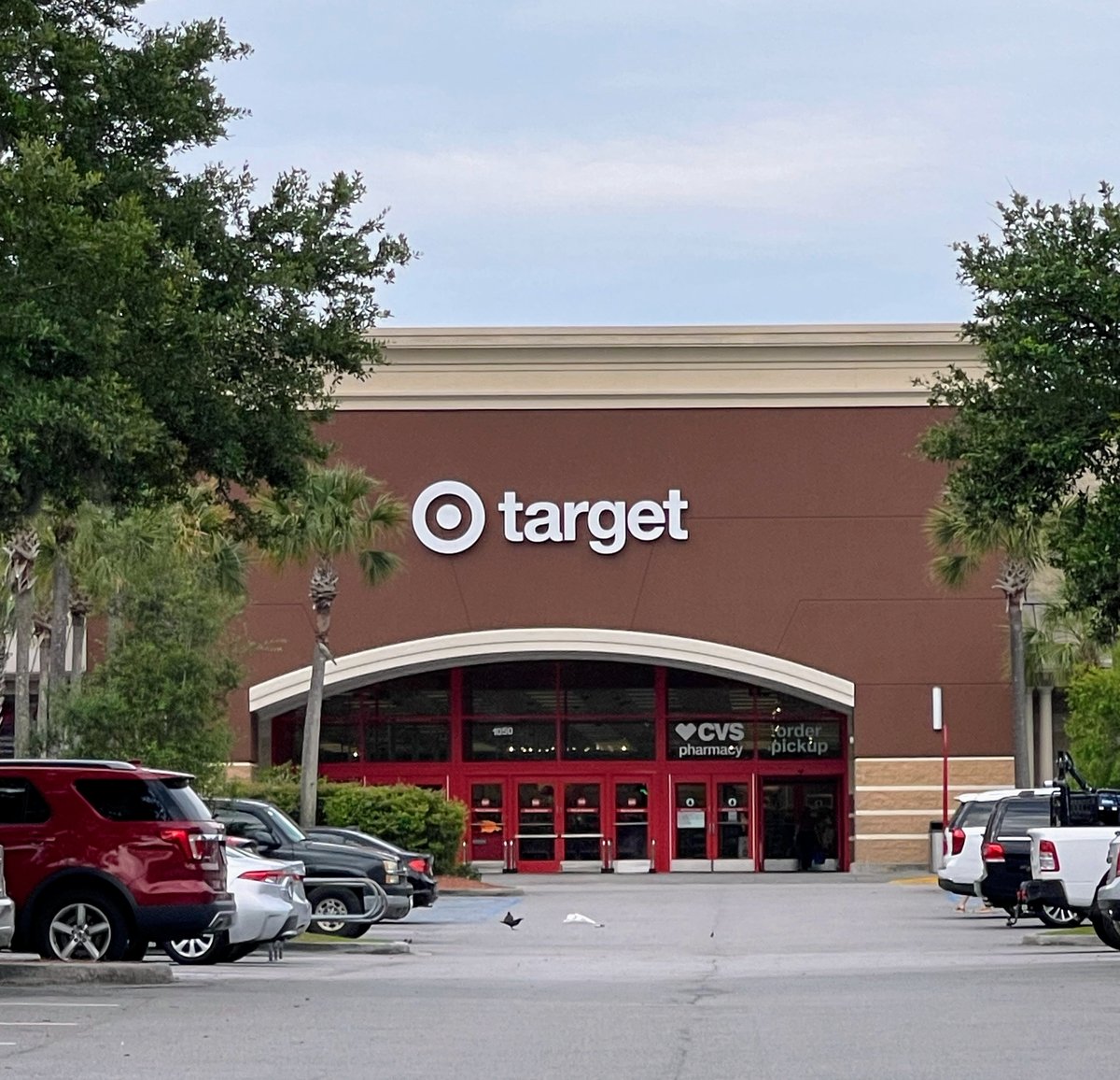 The Bluffton Target entrance head-on — bullseye and red doors, CVS pharmacy window to the right