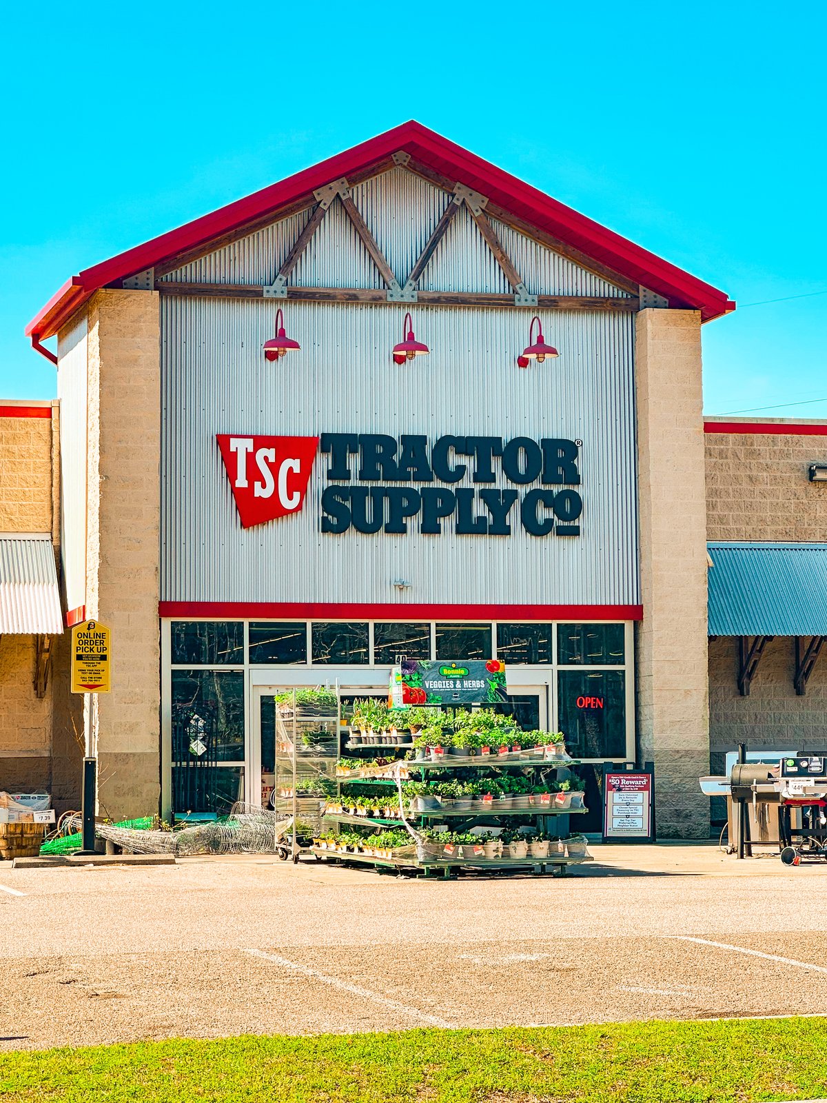 Tractor Supply Co. corrugated gable with TSC sign and plant racks out front, Okatie SC