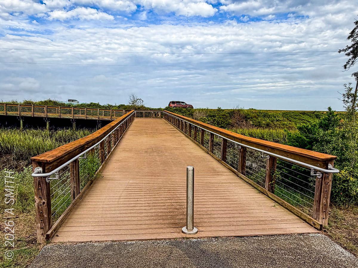 The boardwalk. The ramp running out over the marsh — the archive's own caption calls it the connecting ramp to the bridge.